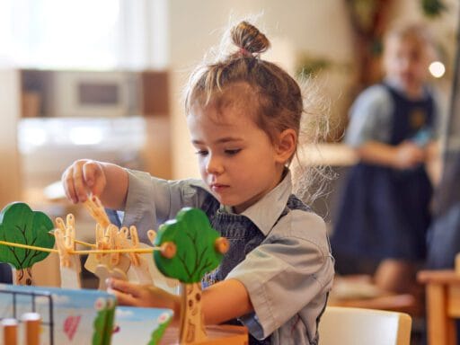 Junior School student engaged in creative play during after hours care at a nurturing girls primary school in Perth.