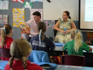IWD JS - St Hilda's Anglican School For Girls Students being read biographies of inspirational women on International Women's Day