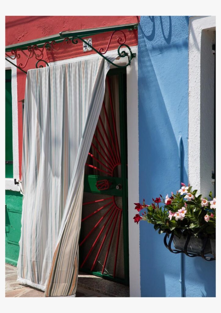 Artist on Show_LetitiaGreen_ShadesofBlue - St Hilda's Anglican School For Girls Doorway hidden behind a striped curtain on a bright red and blue facade, with a green frame and a flower box nearby