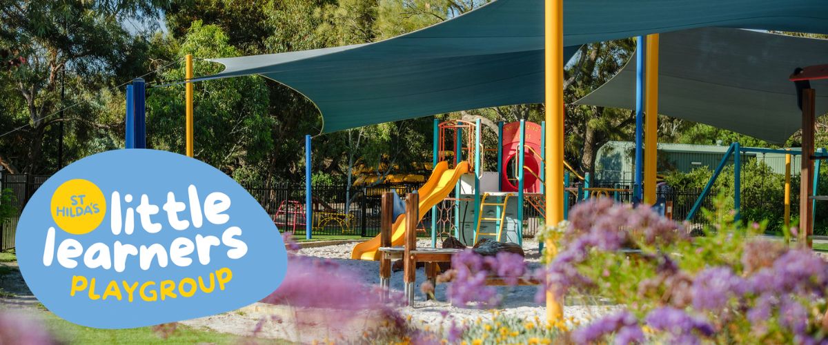 Outdoor playground with slides and climbing frames; a blue logo reads 'St Hilda's Little Learners Playgroup' in the foreground.