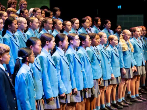 School choir performing choral repertoire as part of music program at an Anglican high school