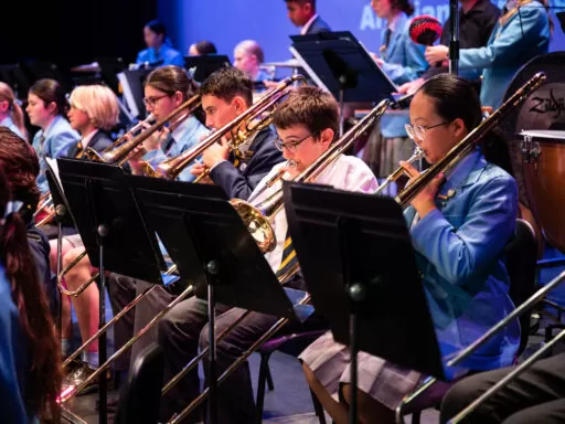 Concert band playing trombone in a large ensemble at a leading girls high school